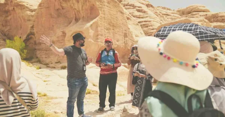 A tour guide is guiding the tourists.