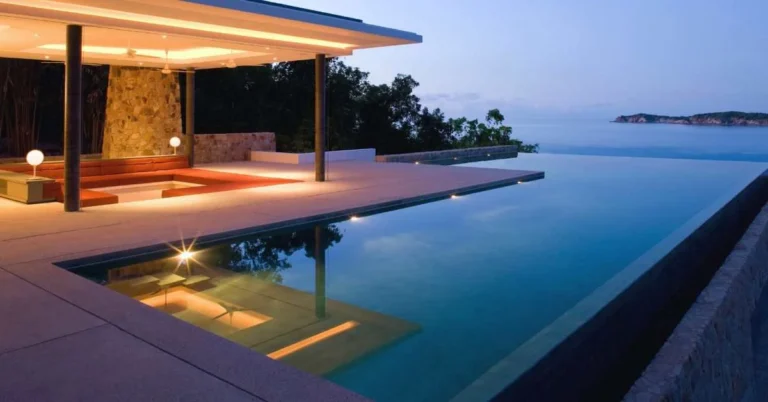 Image showcasing a resort in front of a water lake.