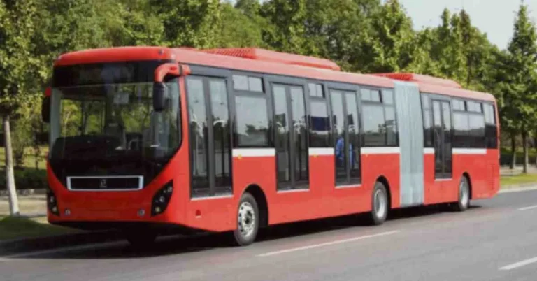 Image showcasing red line metro bus, standing on its track in Islamabad.
