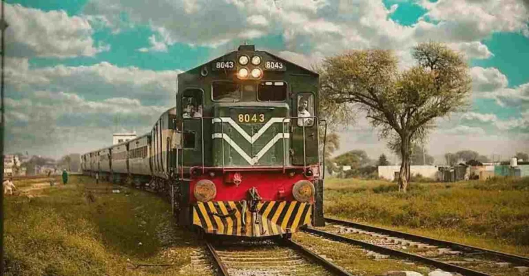 Image showcasing an image of Pakistan railways train being moving on track.